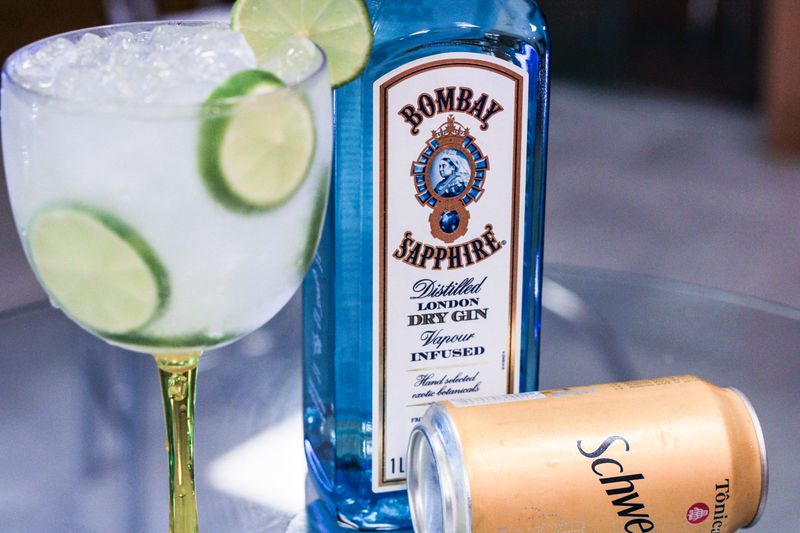 Sparkling Water with lime in glass bottle